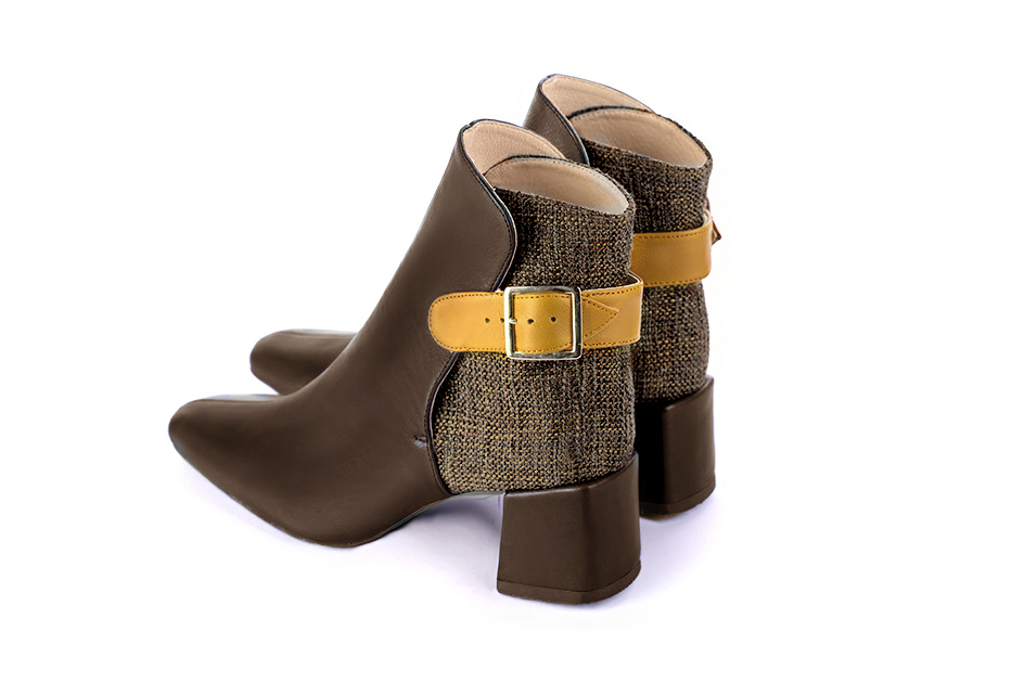 Dark brown and mustard yellow women's ankle boots with buckles at the back. Square toe. Medium block heels. Rear view - Florence KOOIJMAN